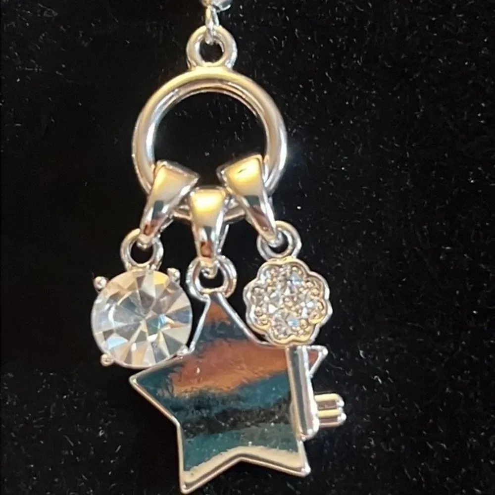 Fun silver tone dangle earrings.